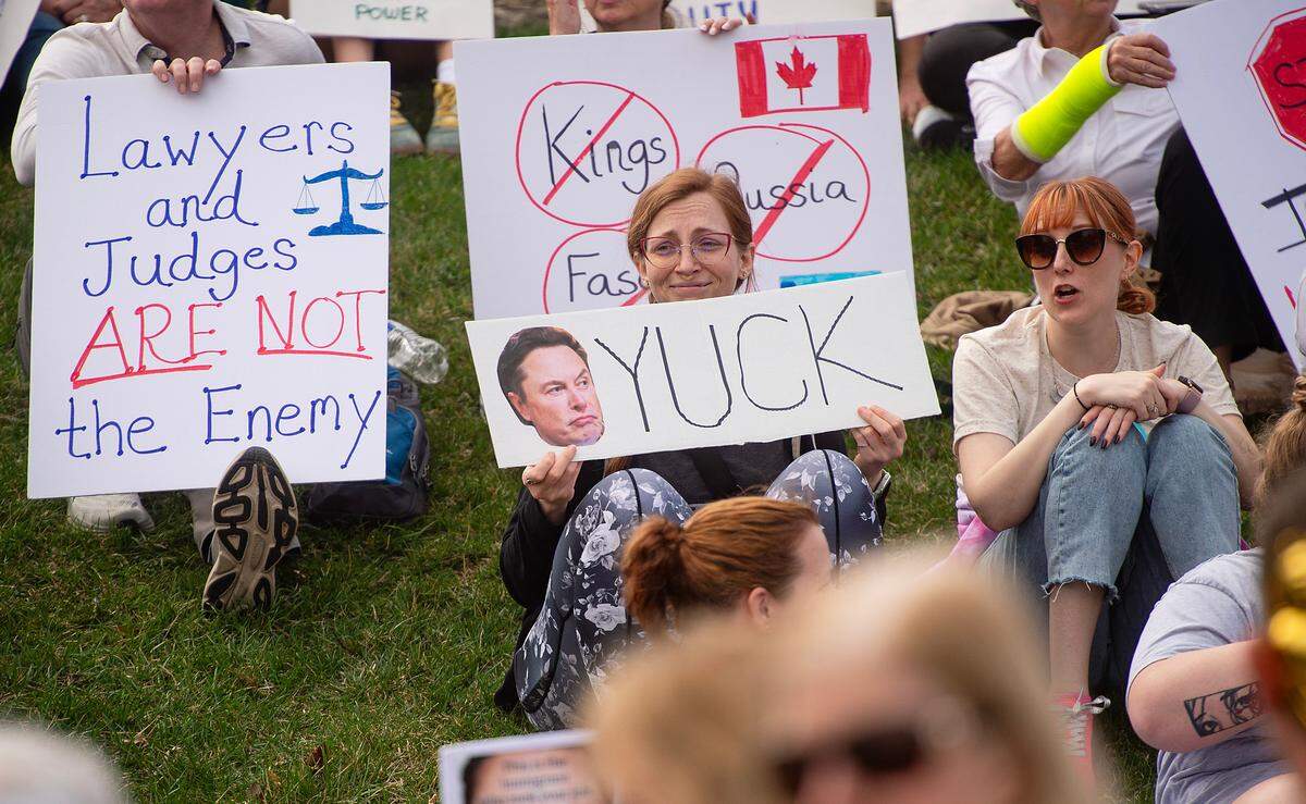 A demonstrator displayed a sign expressing her opinion of D.O.G.E. director Elon Musk during a pro-democracy march that took aim at the Trump administration’s policies Saturday, March 29, 2025 in downtown Kansas City.