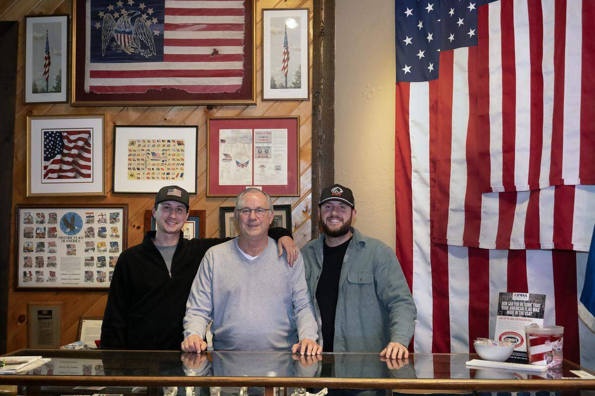 For more than a century, All Nations Flag Co. has been a family-run business in Kansas City. Greg Wald, center, is pictured with his sons, Ryan Wald (left) and Sean Wald (right), who now handle most of the day-to-day operations. Greg Wald is semi-retired.