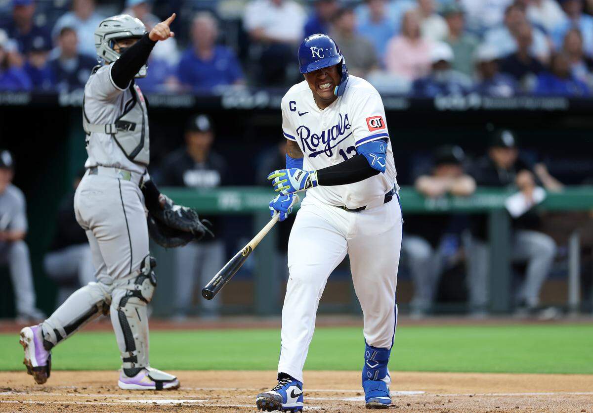 Salvador Perez #13 of the Kansas City Royals reacts after being hit by a pitch during the 1st inning of the game against the Chicago White Sox at Kauffman Stadium on April 09, 2026 in Kansas City, Missouri.
