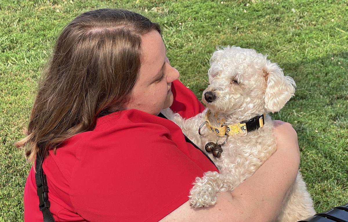 Downtown Kansas City resident Molly Frick spends some time with her dog, Ellie Mae, at the West Terrace Dog Park on Quality Hill.
