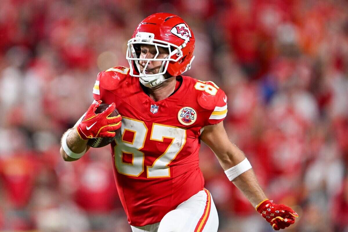 Kansas City Chiefs tight end Travis Kelce (87) runs the ball in the second half of the Kansas City Chiefs vs. Denver Broncos NFL season opener at Arrowhead Stadium in Kansas City on Sept. 14, 2026.