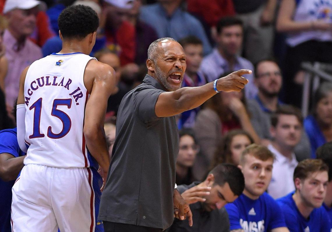 KU interim head coach Norm Roberts yells instructions to the Jayhawks on the floor during the first half of Monday night’s game at Allen Fieldhouse.