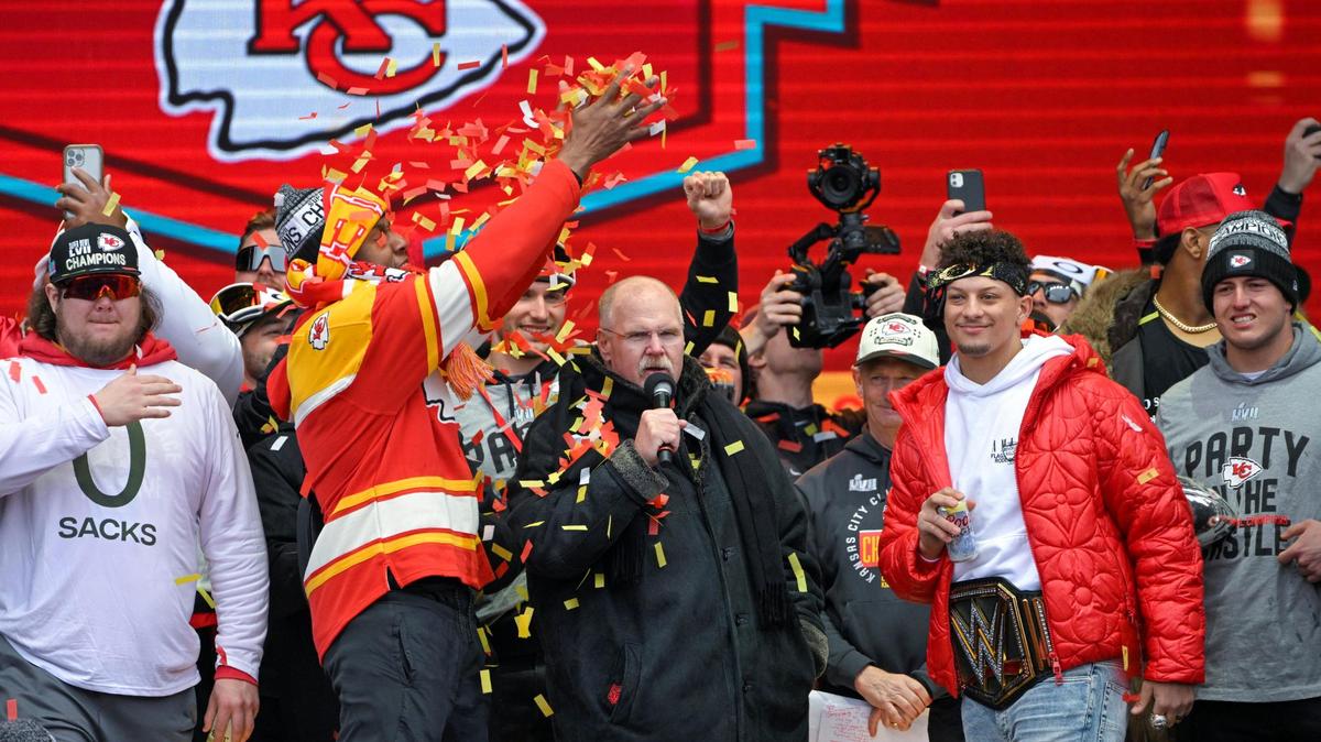 Chiefs center Creed Humphrey, left, looks on while teammate Carlos Dunlap dumps confetti on Chiefs head coach Andy Reid, and quarterback Patrick Mahomes and teammates celebrate on stage at Union Station for the Super Bowl parade on Wednesday, Feb. 15, 2023, in Kansas City.