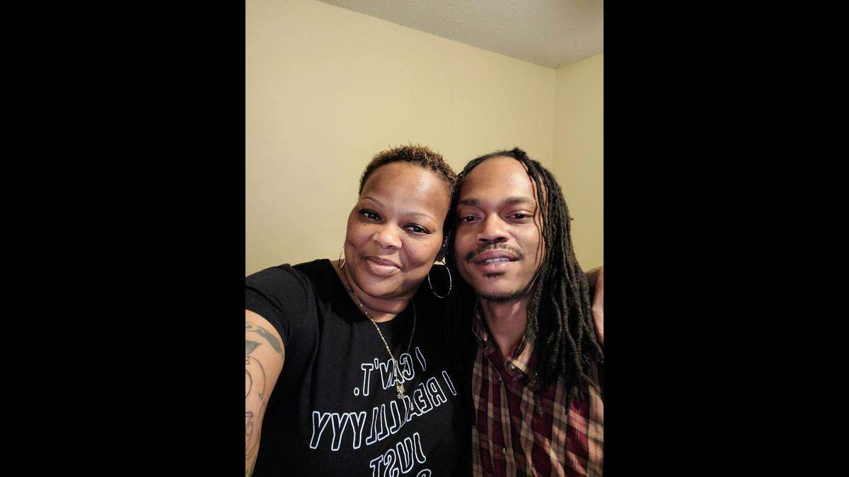 Shelia Brooks poses with her son, Chris Beaugard. Beaugard was shot and killed outside his apartment on Oct. 30.