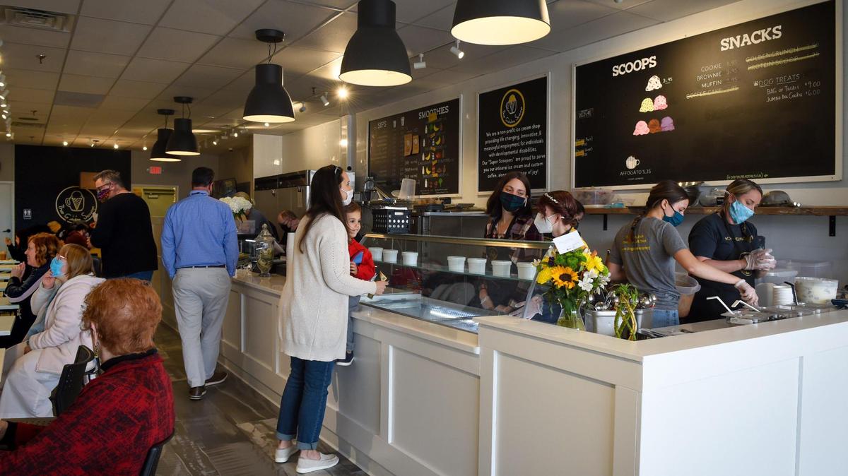 Business was brisk at The Golden Scoop, a new shop serving ice cream and coffeeat 9540 Nall Ave., in Overland Park. The shop employs individuals with developmental disabilities to work in all capacities.