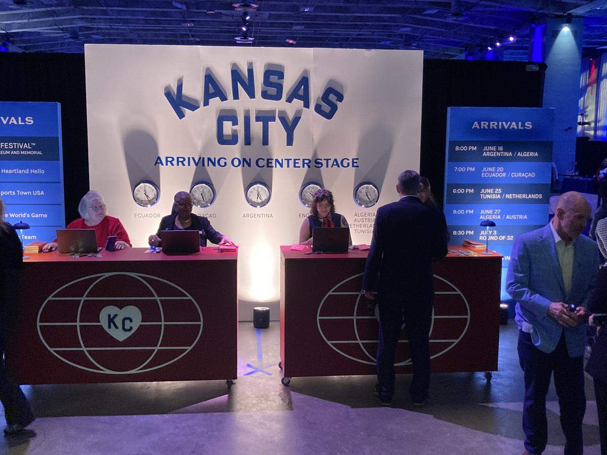 The registration desk at Visit KC’s annual event, held at Municipal Auditorium on May 7, is meant to evoke a 1960s airline ticket counter for the theme “Arriving on Center Stage” about how the city is attracting global visitors for the 2026 FIFA World Cup.