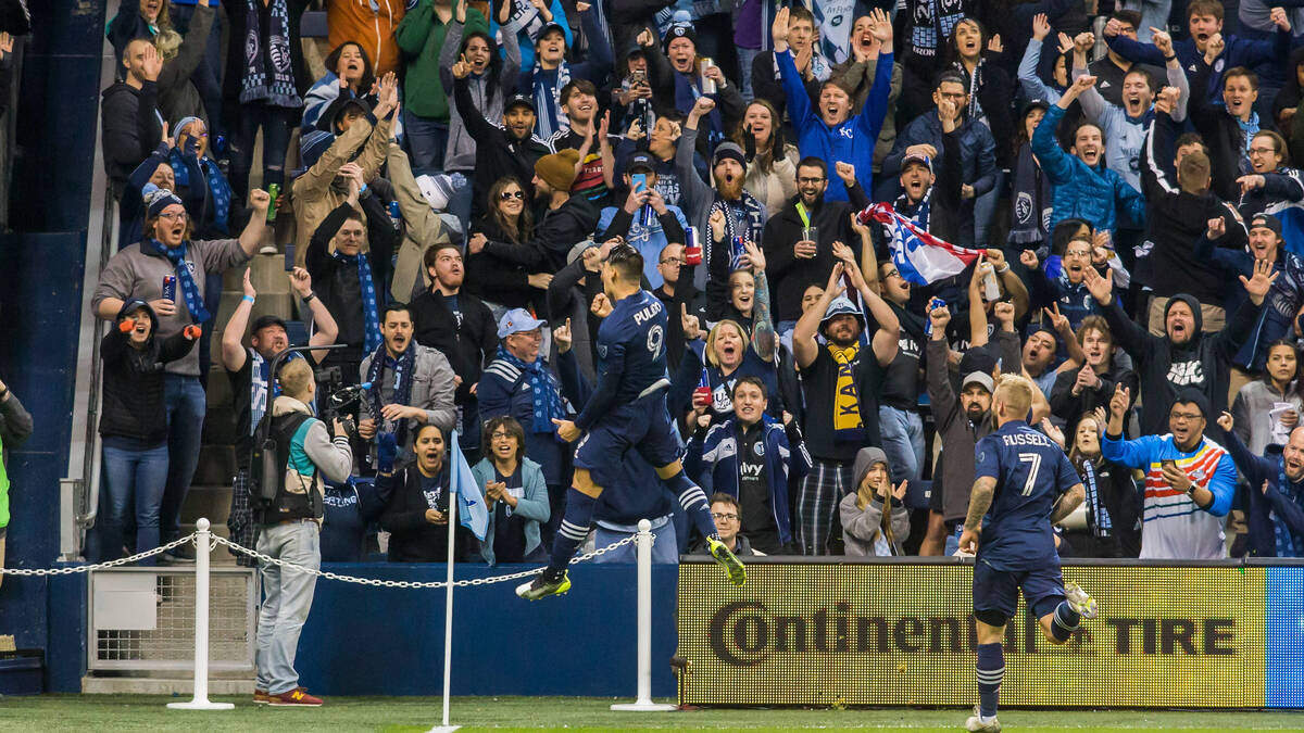 Sporting Kansas City forward Alan Pulido (9) celebrates the opening goal in front of the excited cauldron fanbase during the home opener match between Sporting Kansas City and the Houston Dynamo on Saturday, March 7, 2020 at Children’s Mercy Park in Kansas City, KS. Nick Tre. Smith/Special to the Star