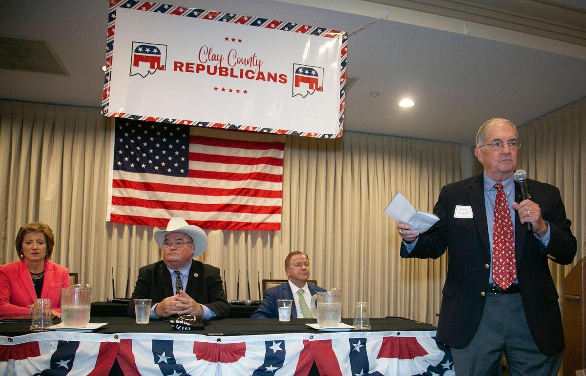 Gary Smedile, chairman of the Clay County Central Republican Party, introduced Republican Senate candidates Vicky Hartzler (left), Billy Long and Mark McCloskey at the candidate forum Friday, Oct. 29, 2021 at Shoal Creek Golf Course in Kansas City.