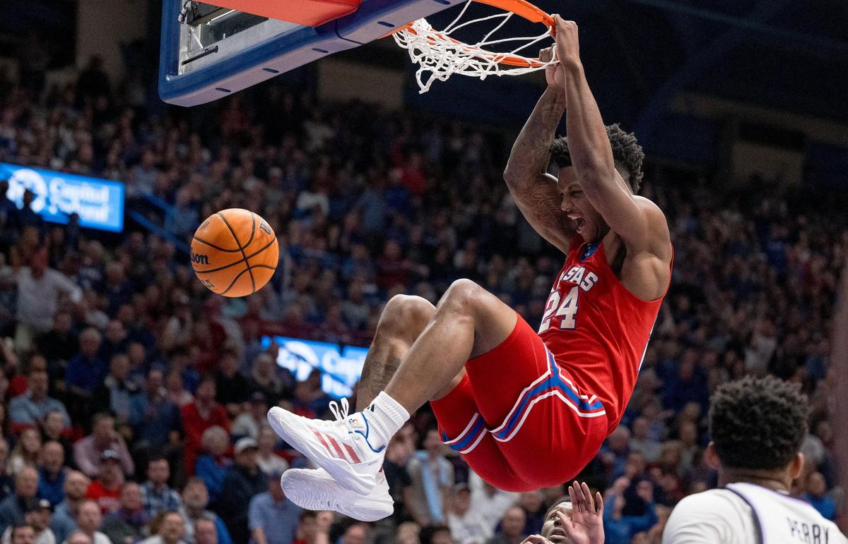 Kansas Jayhawks forward K.J. Adams (24) dunks the ball against the Kansas State Wildcats during an NCAA college basketball game on Tuesday, March 5, 2024, in Lawrence.