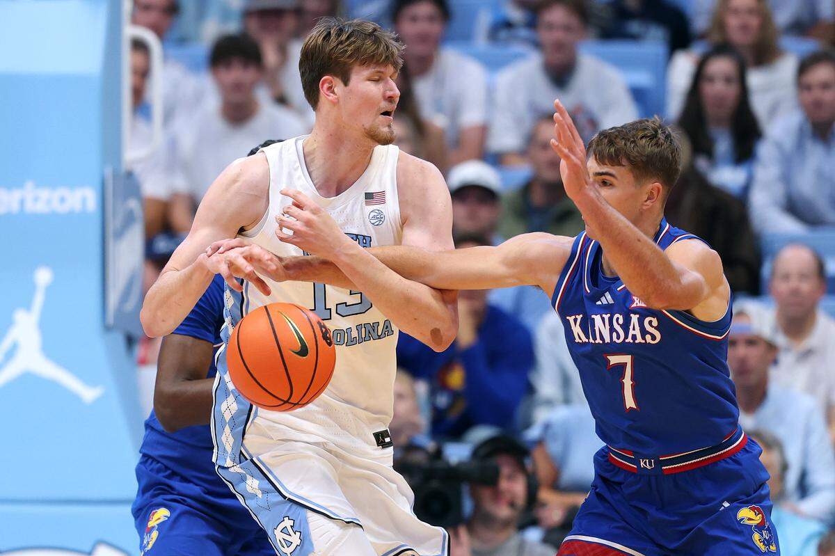 CHAPEL HILL, NORTH CAROLINA - NOVEMBER 07: Kohl Rosario #7 of the Kansas Jayhawks strips the ball from Henri Veesaar #13 of the North Carolina Tar Heels during the first half of the game at Dean E. Smith Center on November 07, 2025 in Chapel Hill, North Carolina. (Photo by Grant Halverson/Getty Images)