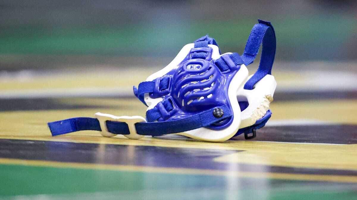 FILE PHOTO: Headgear lays on the floor after a high school wrestling match on Feb. 10, 2024, in Salem, Ore.