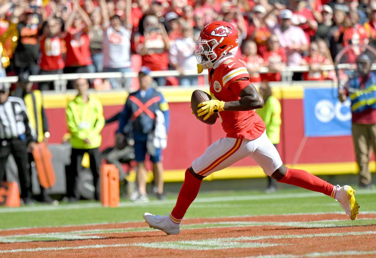 Chiefs wide receiver Hollywood Brown runs into the end zone for a touchdown after catching a pass from Patrick Mahomes during an NFL Week 7 game against the Las Vegas Raiders at GEHA Field at Arrowhead Stadium in Kansas City on Sunday, Oct. 19, 2025.