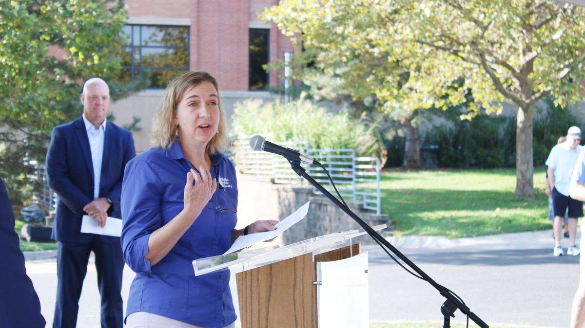 Sara Eccles, branch manager, speaks at the groundbreaking ceremonies for the new Olathe Downtown Library.
