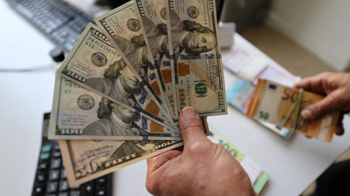 A man counts his money.