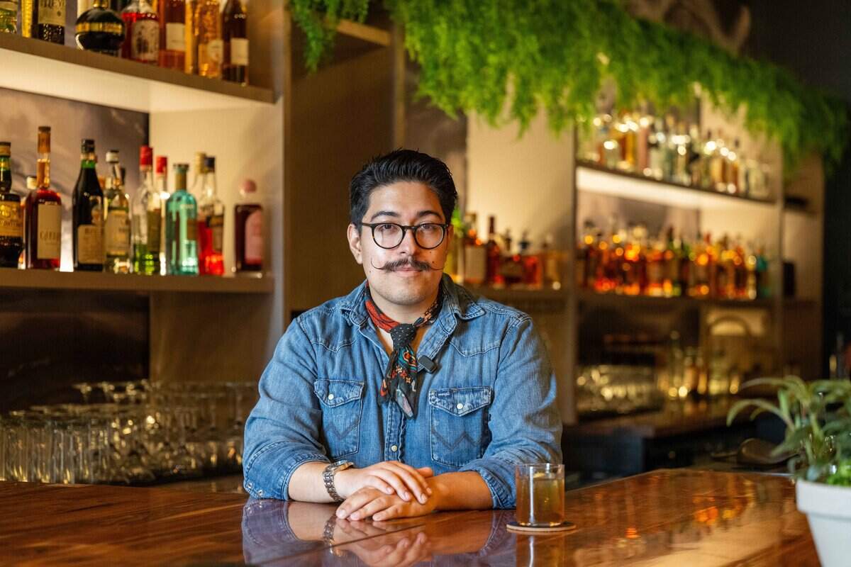 Benjamin Davalos, founder of Neat, a new bar concept opening in Lenexa, mixes two of his signature drinks on Thursday, July 9, 2026. Davalos created the drink menu based on life experiences and stories.