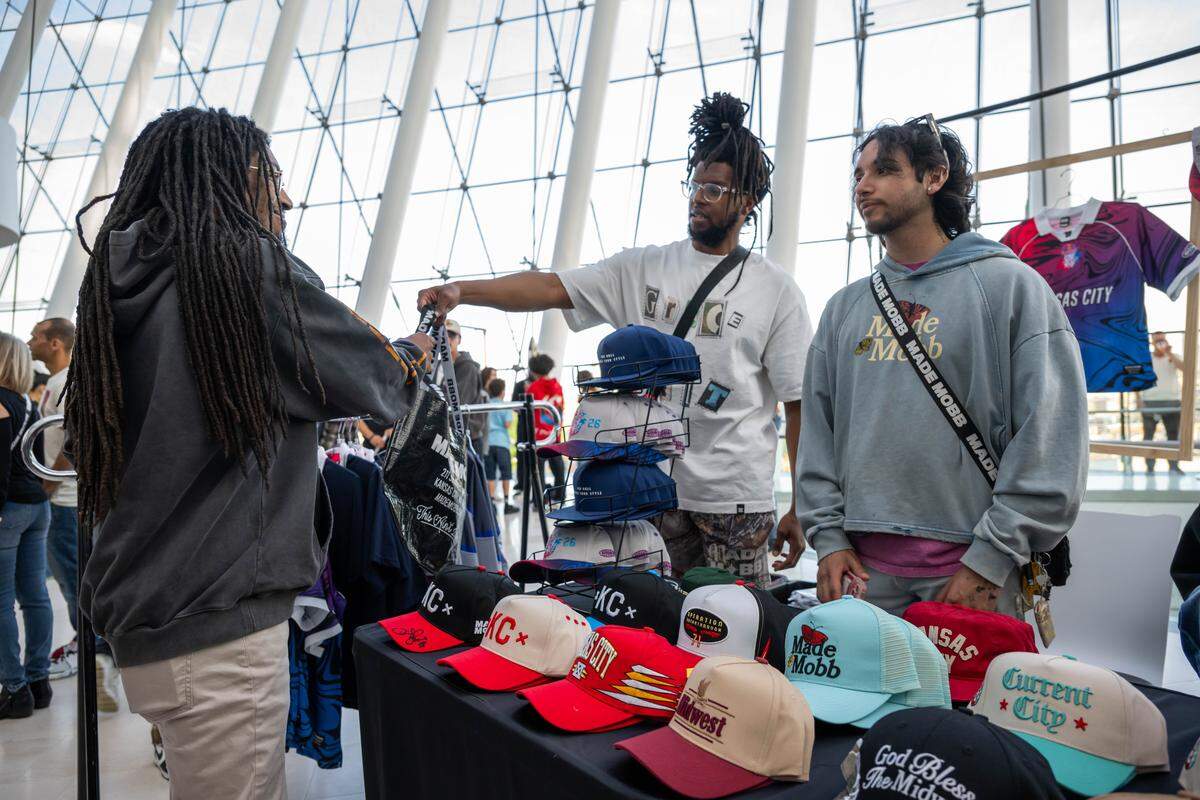 Alex Harris and Ezra Menace of Made Mobb sell some gear to a customer prior to the beginning of the Red Bull Dance Your Style Midwest Regional Qualifier, on Saturday, April 25, 2026, at the Kauffman Center for the Performing Arts. Made Mobb was a primary sponsor for the event.