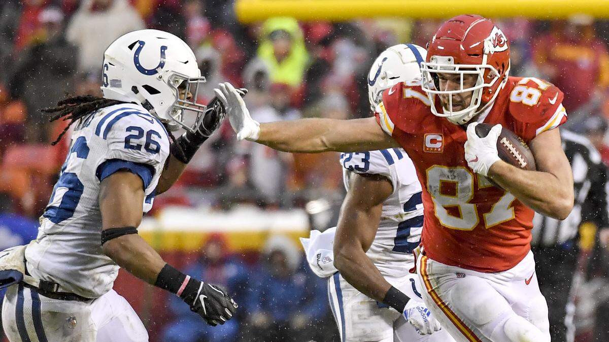 Kansas City Chiefs tight end Travis Kelce stiff armed Indianapolis Colts strong safety Clayton Geathers after pulling in a pass in the second quarter during Saturday’s football game on January 12, 2019 at Arrowhead Stadium in Kansas City, Mo.