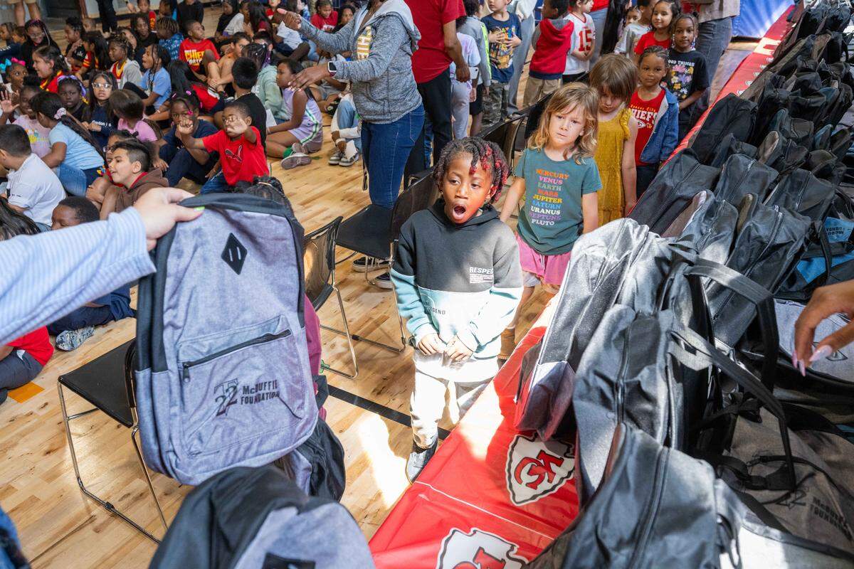 Students at Gordon Parks Elementary School received free backpacks with supplies courtesy of Kansas City Chiefs cornerback Trent McDuffie, on Monday, Aug. 25, 2025, in Kansas City. In addition to signing autographs, McDuffie donated the backpacks, which also included water bottles and school supplies, to 150 kids at the school through his T22 McDuffie Foundation.