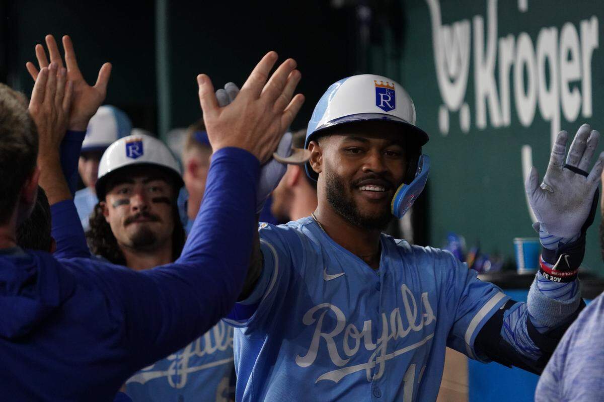 Kansas City Royals third baseman Maikel Garcia (11) is greeted in the dugout after hitting a three-run home run during the third inning against the Texas Rangers at Globe Life Field on Jun 18, 2025 in Arlington, Texas, USA.