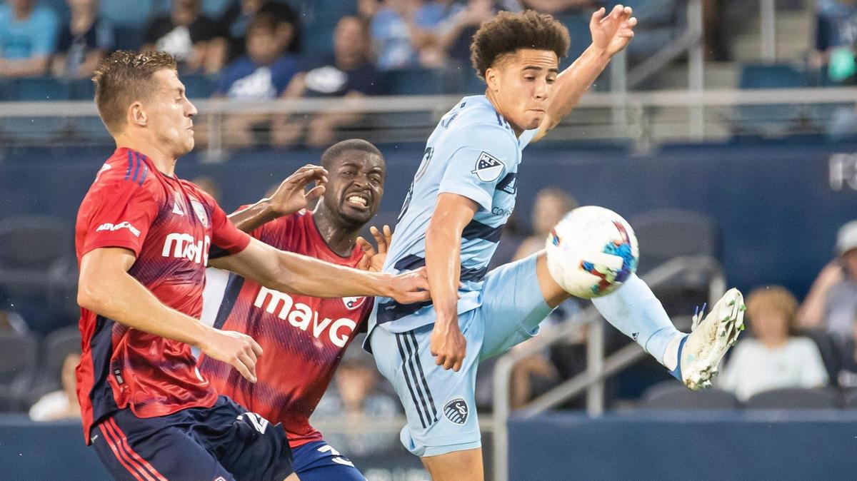 Sporting Kansas City midfielder Cameron Duke (right) brings down the ball during the match against FC Dallas on Tuesday May 10th, 2022 at Children’s Mercy Park in Kansas City, Kansas.