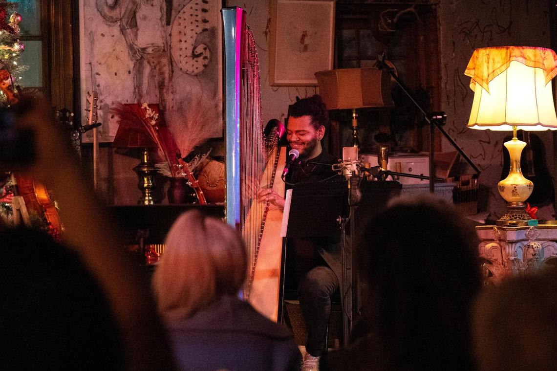 Calvin Arsenia performs at the Greenwood Social Hall. Once Arsenia decided to live his life and create on his own terms, he chose to teach himself to play the harp before moving to Scotland to train under teachers in the harp capital of the world.