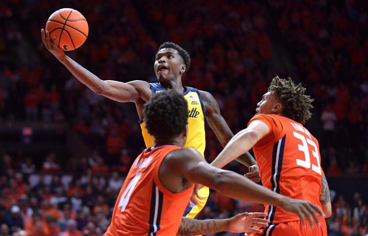 Marquette Golden Eagles guard Kam Jones (1) lays the ball up against the Illinois Fighting Illini at State Farm Center on Nov. 14, 2023.