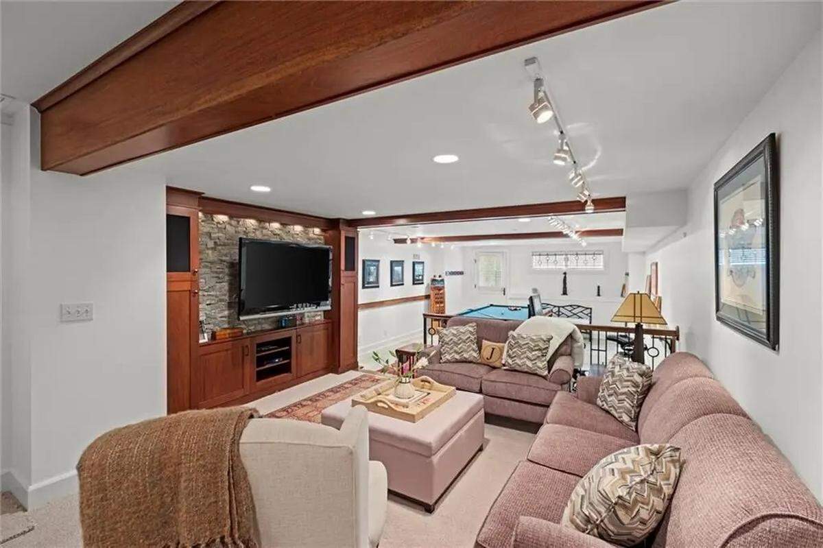 A wet bar completes the finished basement underneath the home at 1234 W. 58th St. The century-old house is located in Kansas City near Ward Parkway and Mission Hills.