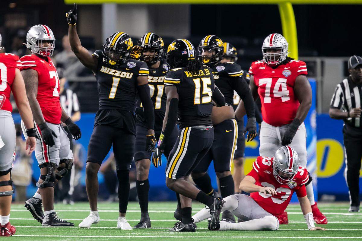 Missouri defensive back JC Carlies (No. 1) and his Tigers teammates celebrate a defensive stop against Ohio State during the 88th annual Cotton Bowl at AT&T Stadium in Arlington, Texas.