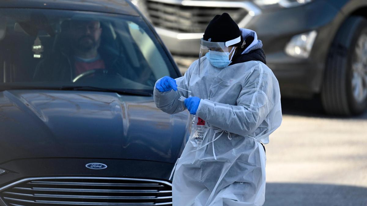 Despite the frigid temperatures, COVID-19 testing was underway at 7820 Prospect Ave., where McKayla Lee, nursing student at Missouri Southern State University, swabbed a client Friday, Jan. 7, 2022, during the drive-through clinic at the Heavy Construction Laborers parking lot in Kansas City. Thursday’s testing clinic was closed because of the extreme cold.