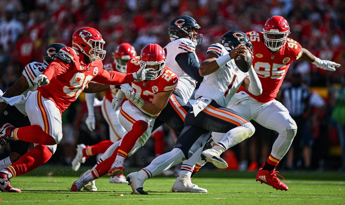 Members of the Kansas City Chiefs defense chase down Chicago Bears quarterback Justin Fields (1) in the first quarter Sunday, Sept. 24, 2023, at GEHA Field at Arrowhead Stadium.