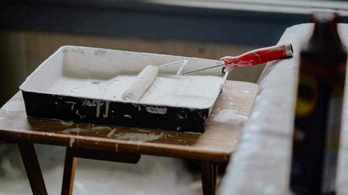 File photo of paint supplies. Federal authorities said a 51-year-old painting contractor died after falling from an unsecured balcony, which then fell on him.