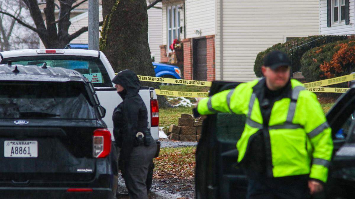 Lenexa Police officers begin marking evidence and taking crime scene photos after a shooting near the 13500 block of West 90th Place Jan. 25, 2024.