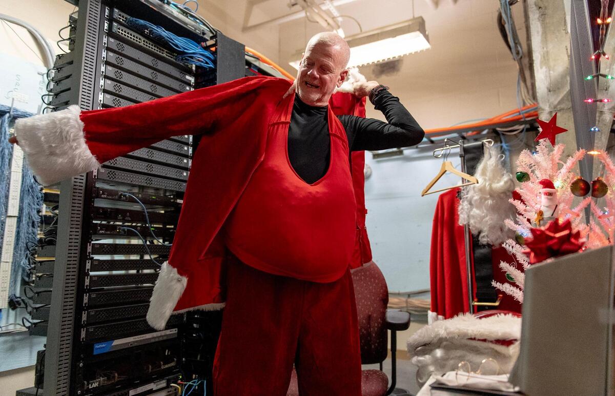 Rob Kinnard’s Santa dressing room is tucked away in the hospital’s communications and server room on a lower level. If he hustles, he can get dressed in about 10 minutes.