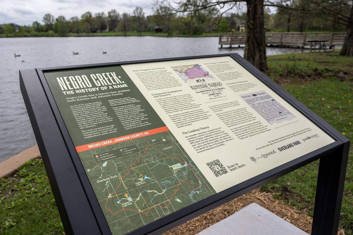 Signage featuring the history of Negro Creek is seen near Kingston Lake at Kingston Lake Park on Monday, April 13, 2026, in Overland Park.