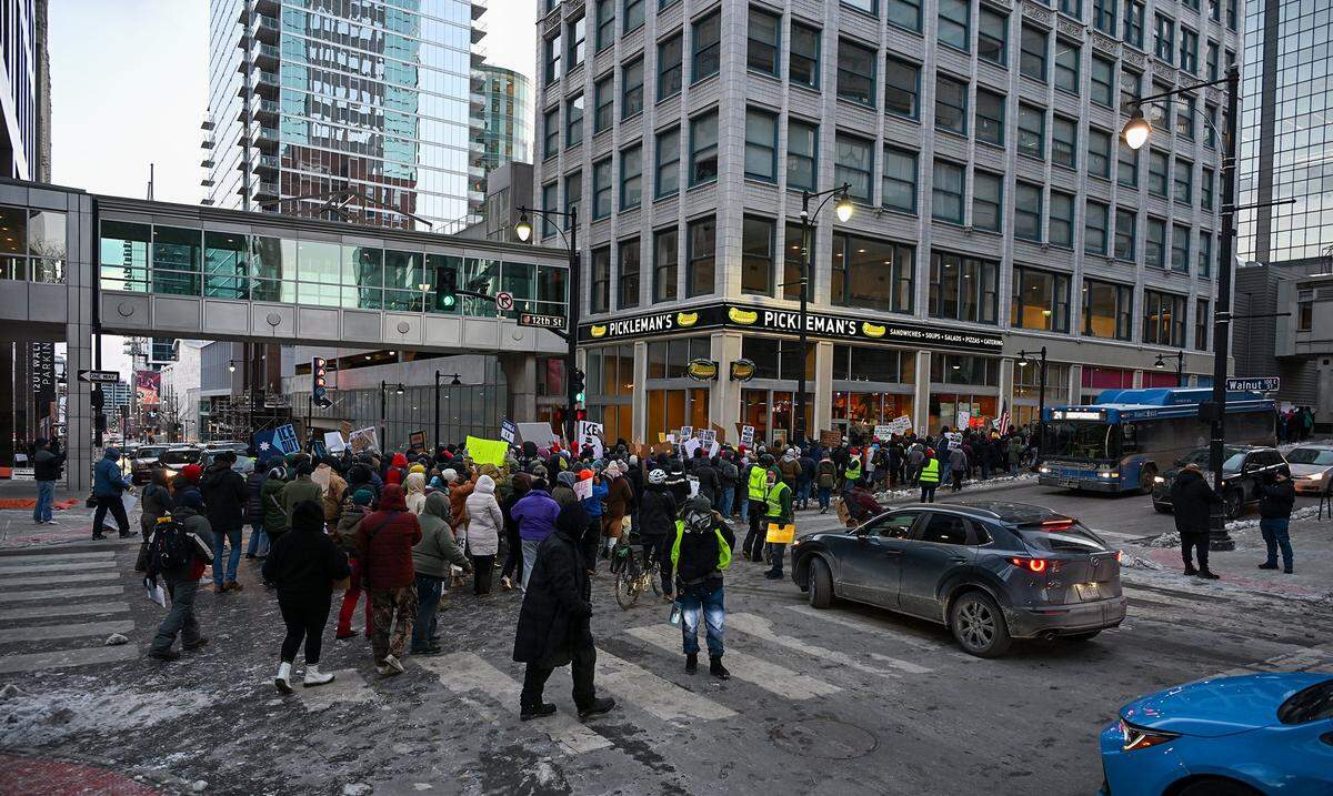 Protesters joined nationwide demonstrations against ICE in downtown Kansas City in freezing temperatures on Friday, Jan. 30, 2026.