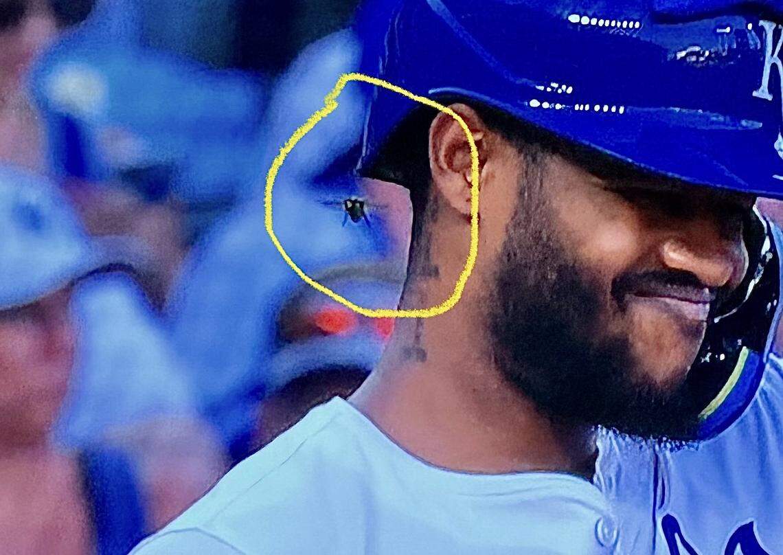This screengrab from the FanDuel Sports Network Kansas City broadcast shows a rather large bumblebee buzzing Royals designated hitter Maikel Garcia while he was at the plate for an at-bat against the Atlanta Braves at Kauffman Stadium in Kansas City on Monday, July 28, 2025.