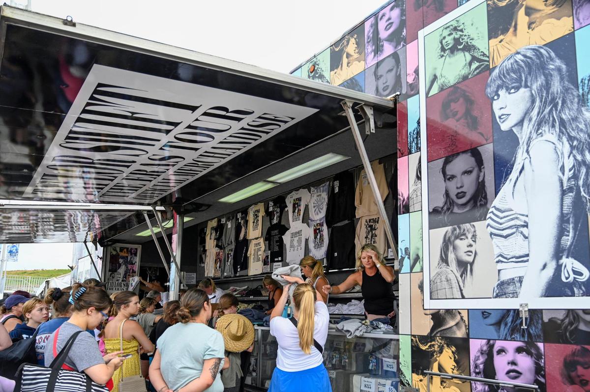 Images of Taylor Swift covered the ‘merch’ truck as Swifties, fans of singer, lined up to buy The Eras Tour merchandise on Thursday, July 6, 2023, at Arrowhead Stadium in Kansas City.