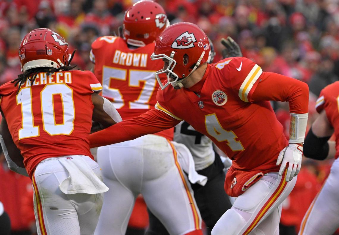 Backup Chiefs quarterback Chad Henne hands the ball to Isiah Pacheco in the first half of the playoff game against the Jacksonville Jaguars on Saturday, Jan. 21, 2023, at Arrowhead Stadium.