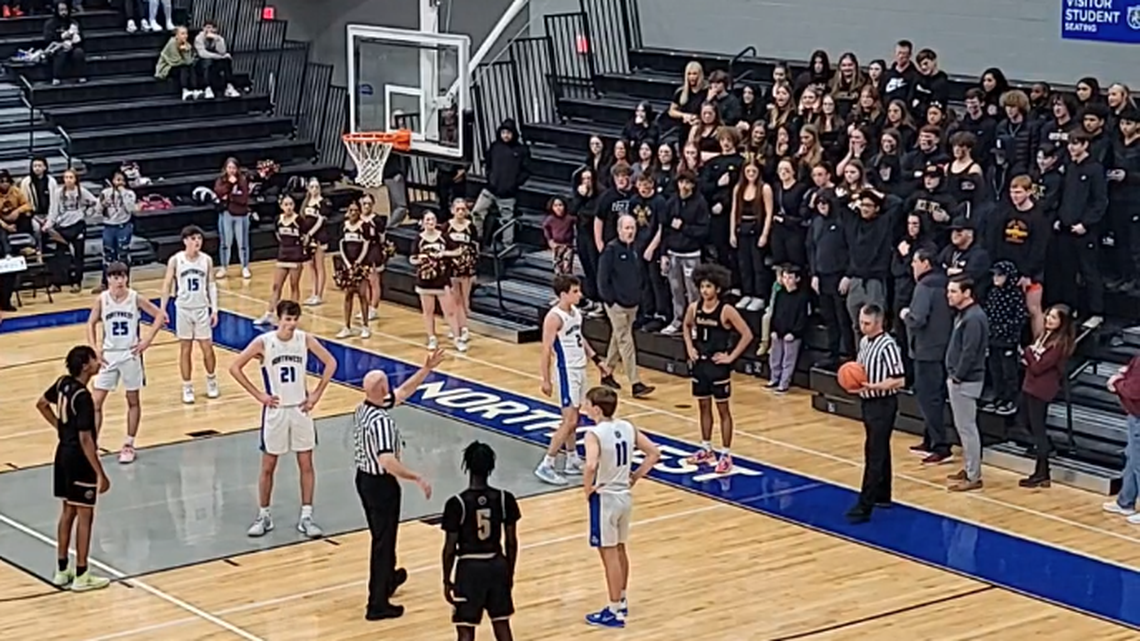 Dozens of Lincoln High School students were thrown out of an Iowa basketball game, video shows.