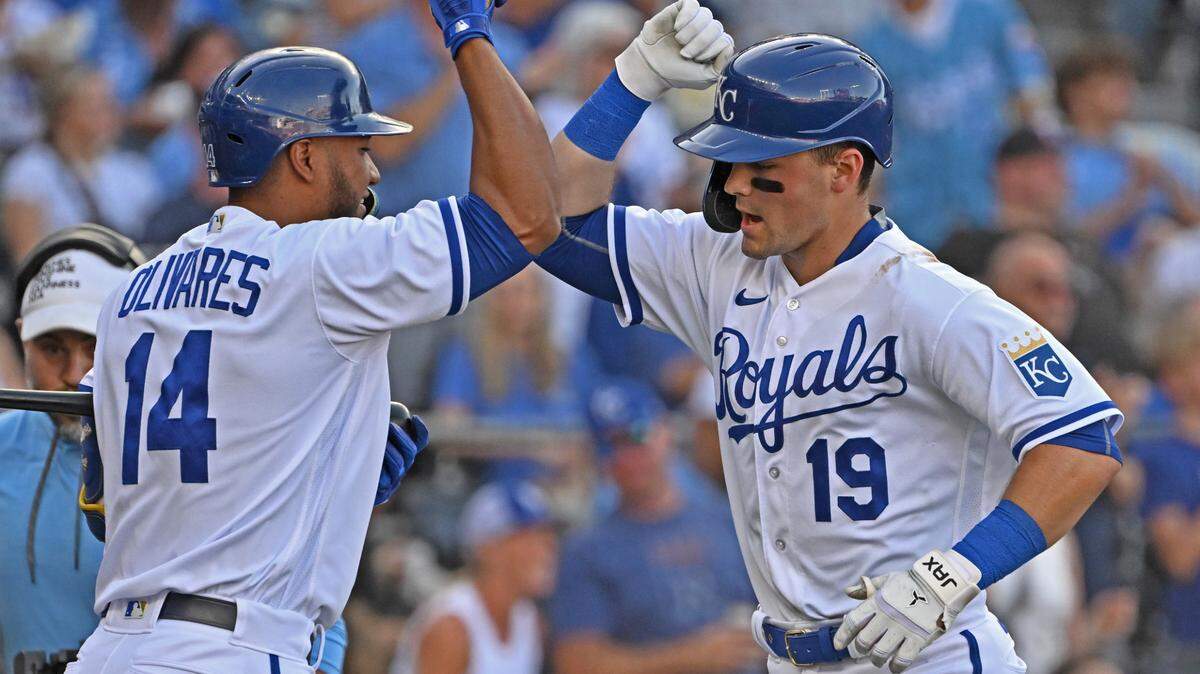 Kansas City Royals second baseman Michael Massey (19) celebrates with Edward Olivares (14) after hitting a solo home run during the second inning against the Minnesota Twins at Kauffman Stadium on July 29, 2023. 
