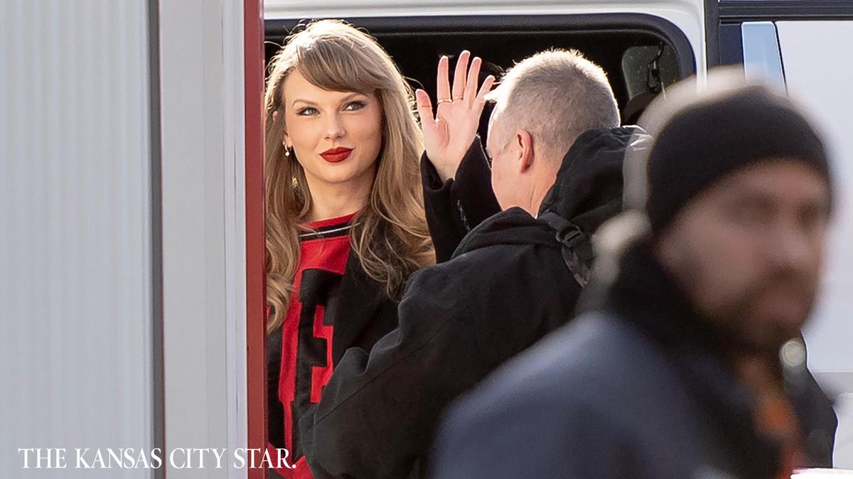 Taylor Swift gives onlookers a little wave as she arrives at GEHA Field at Arrowhead Stadium to watch boyfriend Travis Kelce and the Kansas City Chiefs play the Buffalo Bills on Dec. 10.