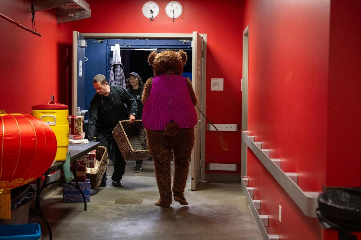 The Bear character heads to the stage for his scene in the Kansas City Ballet’s “The Nutcracker” during the final dress rehearsal.