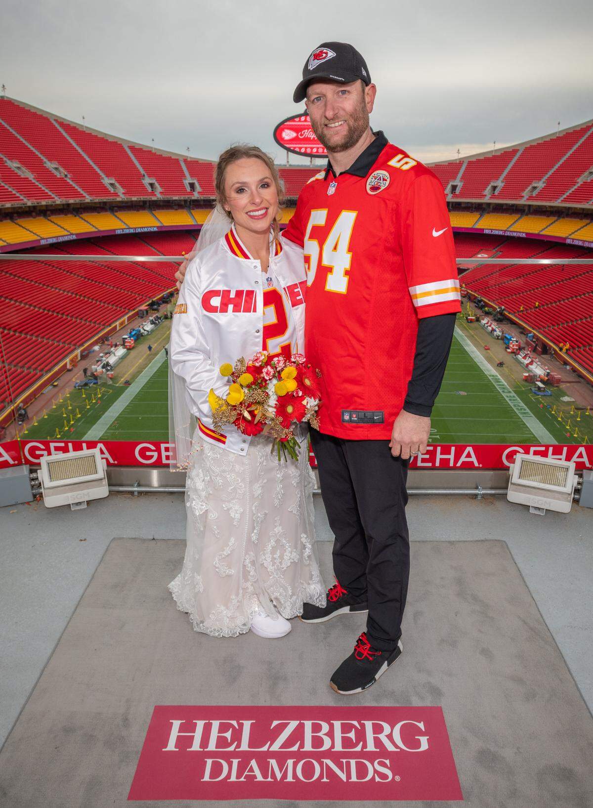 Jordyn Burnidge and Chad Clauser, of Kansas City, North, exchanged wedding vows on the GEHA Deck at Arrowhead Sunday after winning a contest conducted by Helzberg Diamonds to be married at a Chiefs home game.