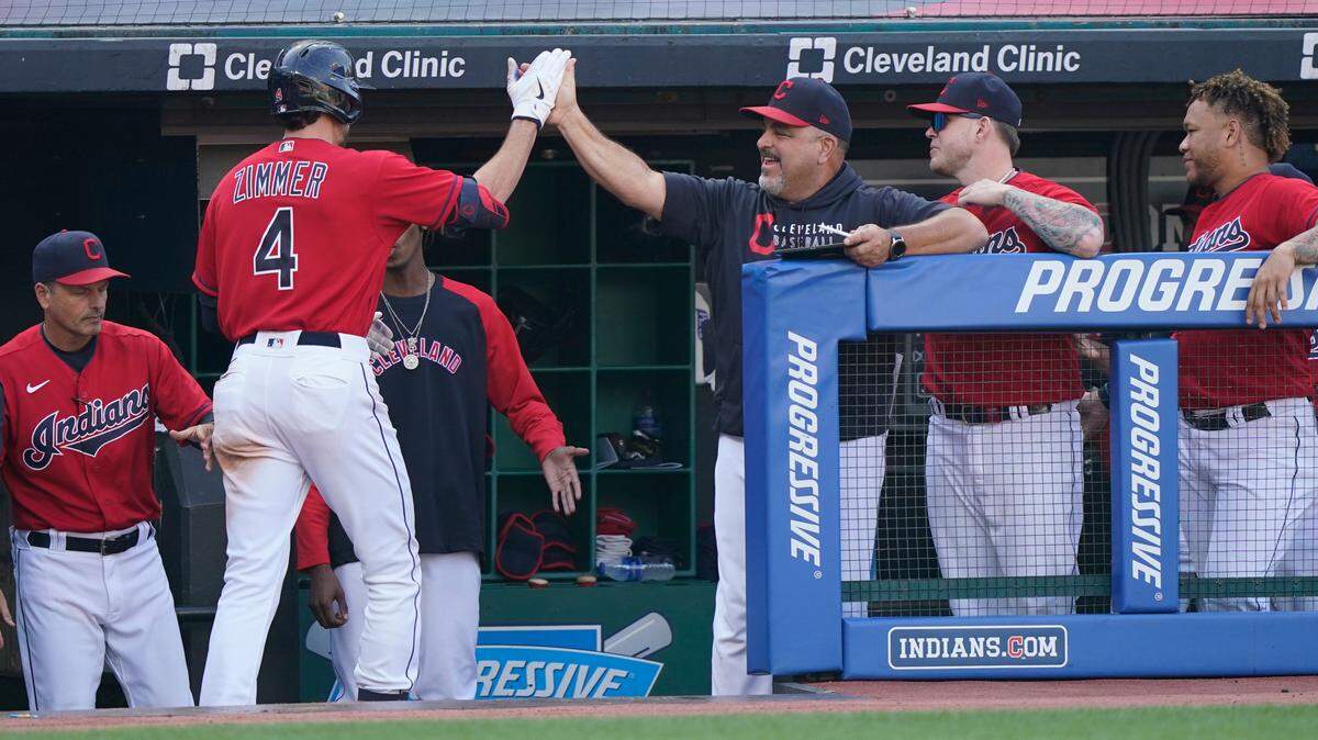Cleveland Indians’ Bradley Zimmer is congratulated after hitting a solo home run in the eighth inning of a baseball game against the Kansas City Royals, Monday, Sept. 27, 2021, in Cleveland. (AP Photo/Tony Dejak)