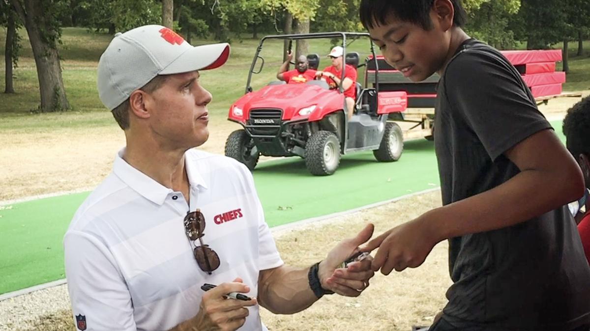 Kansas City Chiefs owner Clark Hunt returned a card after signing an autograph for a fan during training camp for the Kansas City Chiefs at Missouri Western State University on Saturday, Aug. 4, 2018, in St. Joseph, Missouri.