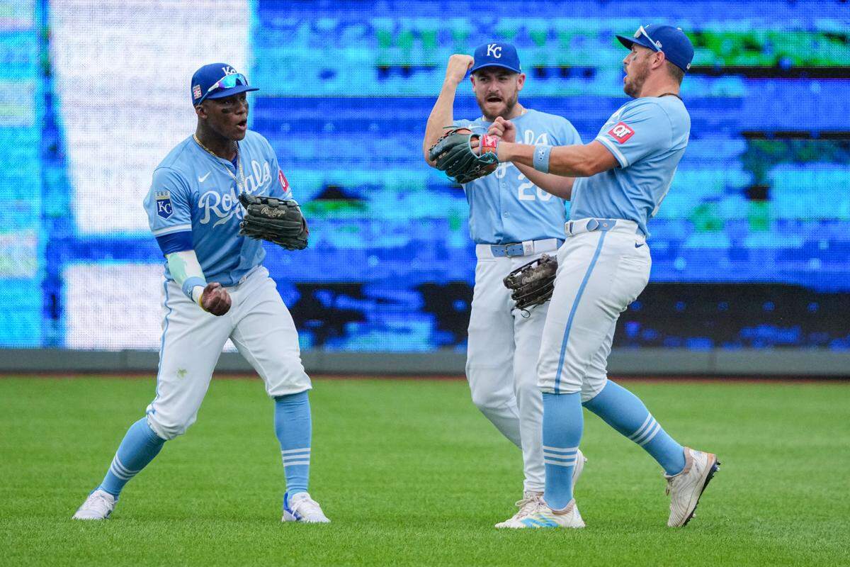 Kansas City Royals outfielders (from left) Dairon Blanco, Kyle Isbel and Hunter Renfroe celebrate after the final out is made in a July 2024 victory at Kauffman Stadium, which clinched a series sweep of the Chicago White Sox.
