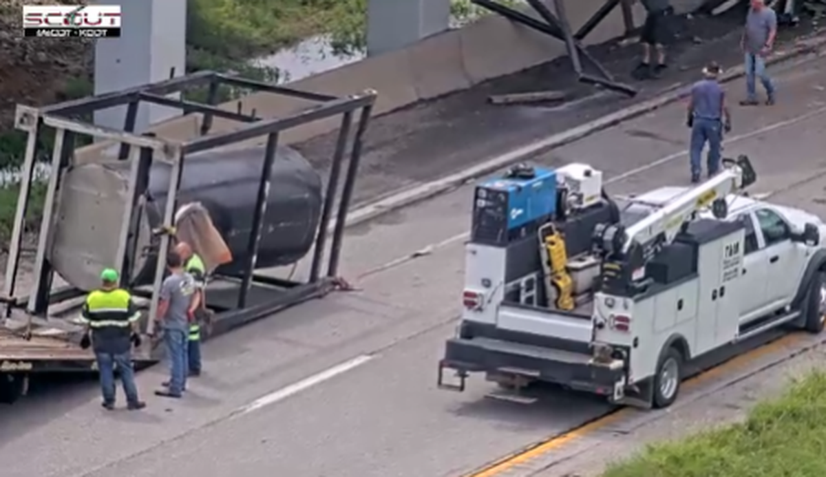 Part of one of the tanks that became dislodged under the bridge on northbound I-35
