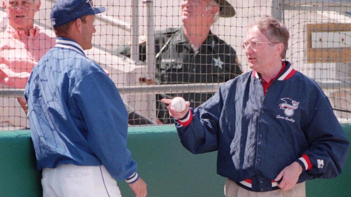 Gene Budig, right, whose career included stints as president of baseball’s American League and chancellor at KU, talks with Royals vice president George Brett before a spring training game in 1996 in Florida. Budig died Tuesday.
