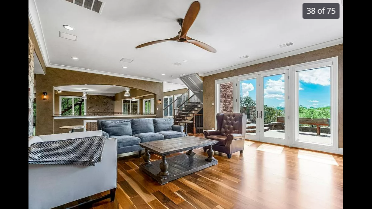 One of the family rooms inside the home at 27596 W. Highland Circle in Olathe is spacious and gives you access to one of the backyard porches for outdoor viewing.