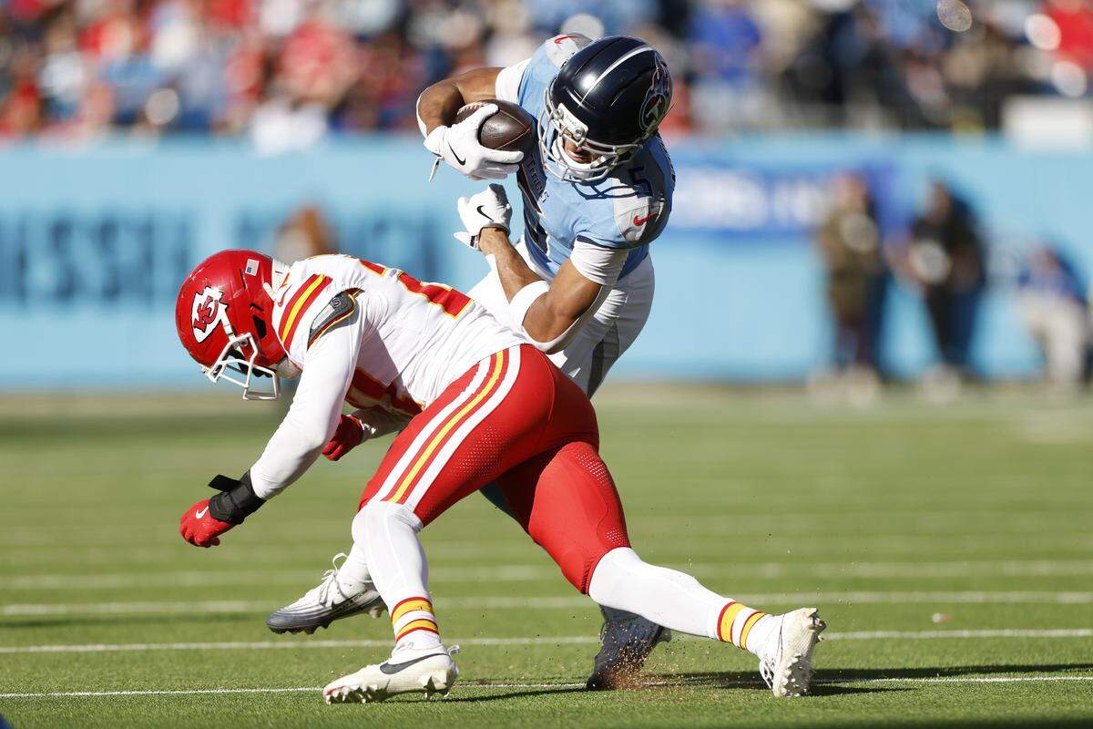 Kansas City Chiefs defensive back Chamarri Conner (No. 27) tackles Tennessee’s Elic Ayomano during an NFL Week 16 game against the Titans at Nissan Stadium in Nashville on Sunday, Dec. 21, 2025.